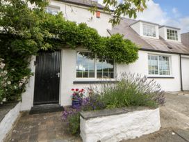 An entrance with a door and plants at Beach Retreat in Aberporth