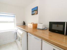 A kitchen with appliances on a countertop at Beach Retreat Aberporth