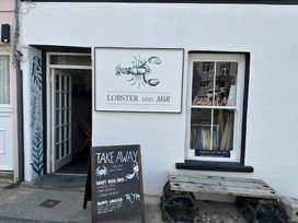 An outdoor view of a restaurant called Lobster and Môr in Little Haven, Pembrokeshire