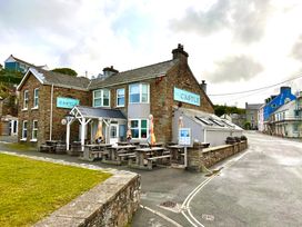 A pub with outdoor seating at The Castle in Little Haven, Pembrokeshire