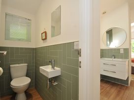 A bathroom with a sink and toilet at The Hideout in Lanreath
