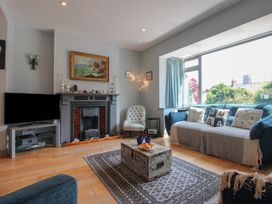 A living room with a sofa and a coffee table at Anchor Cottage in Salcombe