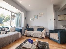 A living room with a sofa and armchair at Anchor Cottage in Salcombe