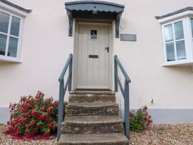 The entrance of Weavers Cottage with steps and flowers in Carlton-in-Cleveland near Stokesley
