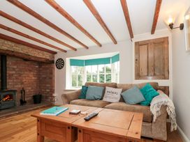 A living room with a sofa and coffee table at Weavers Cottage Carlton-in-Cleveland near Stokesley