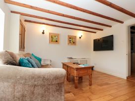 A living room with a sofa and coffee table at Weavers Cottage in Carlton-in-Cleveland near Stokesley
