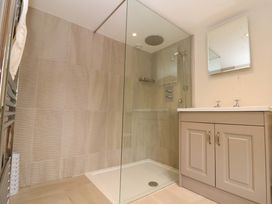 A bathroom with a shower and sink at Weavers Cottage Carlton-in-Cleveland near Stokesley