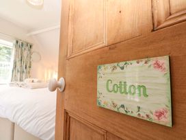 A door with a sign labeled Cotton leading to a bedroom at Weavers Cottage in Carlton-in-Cleveland near Stokesley