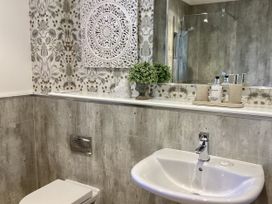 A bathroom with a sink and toilet at Larchwood Lodge in Ellon