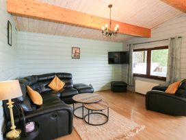 A living room with a sofa and coffee table at Sunny View in Rhayader