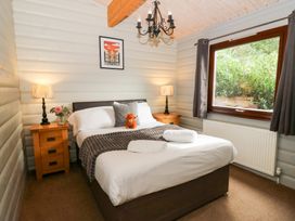 A bedroom with a double bed and nightstands at Sunny View in Rhayader