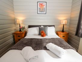 A bedroom with a bed and side tables at Sunny View in Rhayader