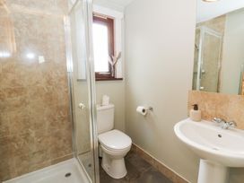 A bathroom with shower, toilet, and sink at Sunny View in Rhayader