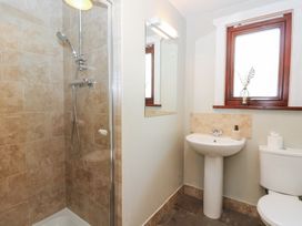 A bathroom with a shower, sink and toilet at Sunny View in Rhayader