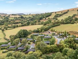 An aerial view of a landscape with cabins and greenery at Sunny View in Rhayader