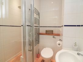 A bathroom with a shower, toilet, and sink at Lanapoule in Salcombe