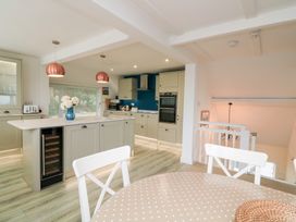 A kitchen with an island and appliances at Lanapoule in Salcombe