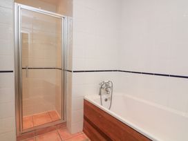 A bathroom with a shower and bathtub at Lanapoule in Salcombe