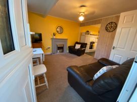 A living room with a television and fireplace at 246 California Road California, Norfolk