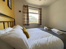 A bedroom with a bed and window at 246 California Road, California, Norfolk
