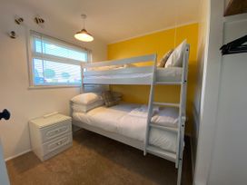 A bedroom with a bunk bed and a nightstand at 246 California Road, California, Norfolk