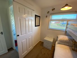 A bedroom with a bunk bed and a mirror at 246 California Road, California, Norfolk