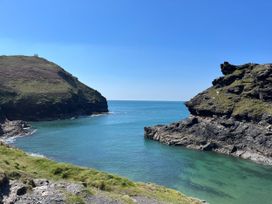 A coastal view with water and cliffs at Ripple St Mabyn near Wadebridge