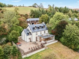 An outdoor area with a house and terrace at Valley View in Rhayader