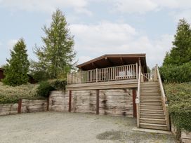 A house with a deck and stairs at Mountain View in Rhayader