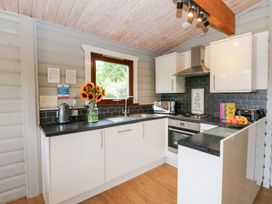 A kitchen with a sink and cabinets at Mountain View in Rhayader
