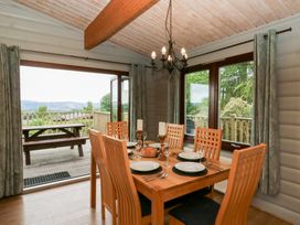 A dining room with a table and chairs at Mountain View in Rhayader