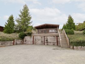 A house with a deck and staircase at Mountain View in Rhayader
