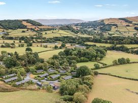 An aerial view of fields and cabins at Mountain View in Rhayader