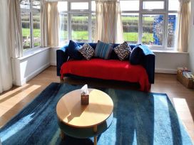 A living room with a sofa and coffee table at Buttercups at Midway in Kington