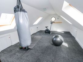 A gym with a punching bag and exercise equipment at Mountain Farm in Broad Haven