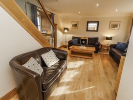 A living room with sofas and a coffee table at Low Croft in Embleton