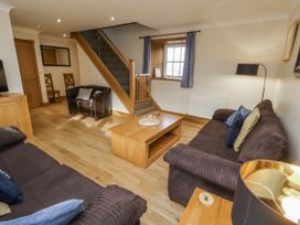 A living room with sofa and coffee table at Low Croft in Embleton