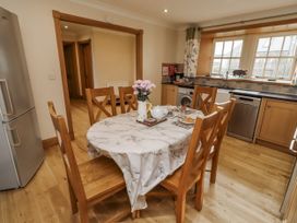A kitchen with a table and chairs at Low Croft in Embleton