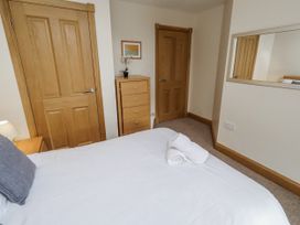A bedroom with a bed and drawer unit at Low Croft in Embleton