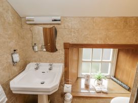 A bathroom with sink and mirror at Low Croft in Embleton