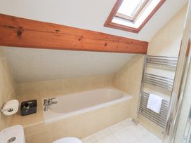 A bathroom featuring a bathtub and a towel radiator at Drystones in Grasmere
