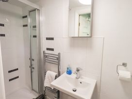 A bathroom with a shower and sink at Drystones in Grasmere