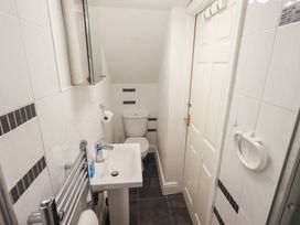 A bathroom with a toilet and sink at Drystones Grasmere