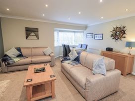 A living room with sofas and a coffee table at Lakeland Loft in Windermere
