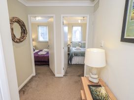 A hallway with bedrooms on either side at Lakeland Loft Windermere