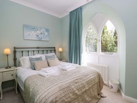 A bedroom with a bed and bedside table at Chapel How in Ambleside