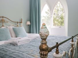 A bedroom with a bed and window at Chapel How in Ambleside
