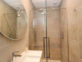 A bathroom with a shower and sink at Chapel How in Ambleside