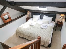 A bedroom with a bed and bedside tables at Chapel How Ambleside