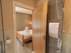 A view of a bathroom leading to a bedroom at Abbots Reading Mews 1 in Grizedale
